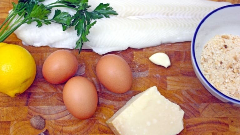 Ingredients for making fish balls: halibut, eggs, parsley, Parmesan.