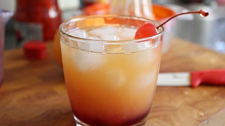 Cocktail with tequila, orange juice, grenadine and maraschino cherry