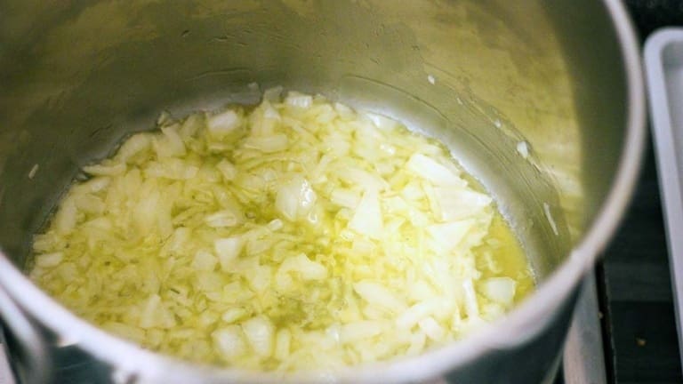 Cooking onions in butter for making the real authentic risotto alla milanese