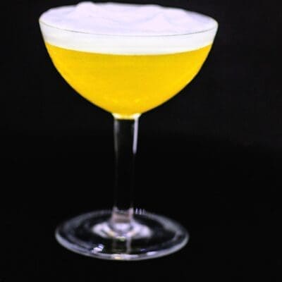 Macho Man cocktail recipe, aperitif with grappa, saffron, limoncello, pineapple