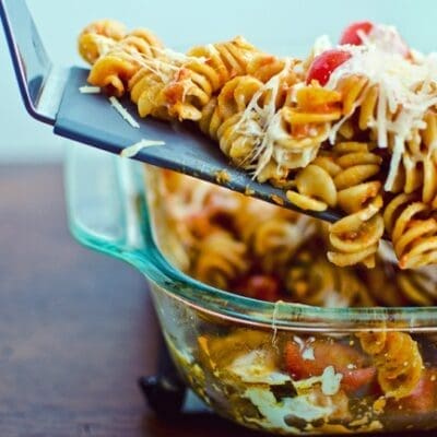 Baked pasta with tomatoes and mozzarella. Pasta caprese. Italian food.